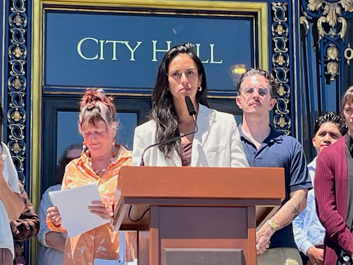 Sup. Jackie Fielder speaks at a rally on the steps of City Hall